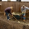 3: Pouring cement into forms.