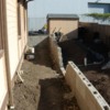 8: Concrete block wall looking east.